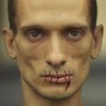 Russian Artist Sews Mouth Shut to Protest Jailing of Punk Band Pussy Riot Russian Artist Sews Mouth Shut to Protest Jailing of Punk Band Pussy Riot